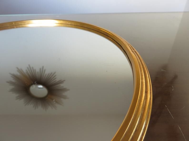 Round mirror tray in 1950s gold metal