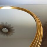 Round mirror tray in 1950s gold metal