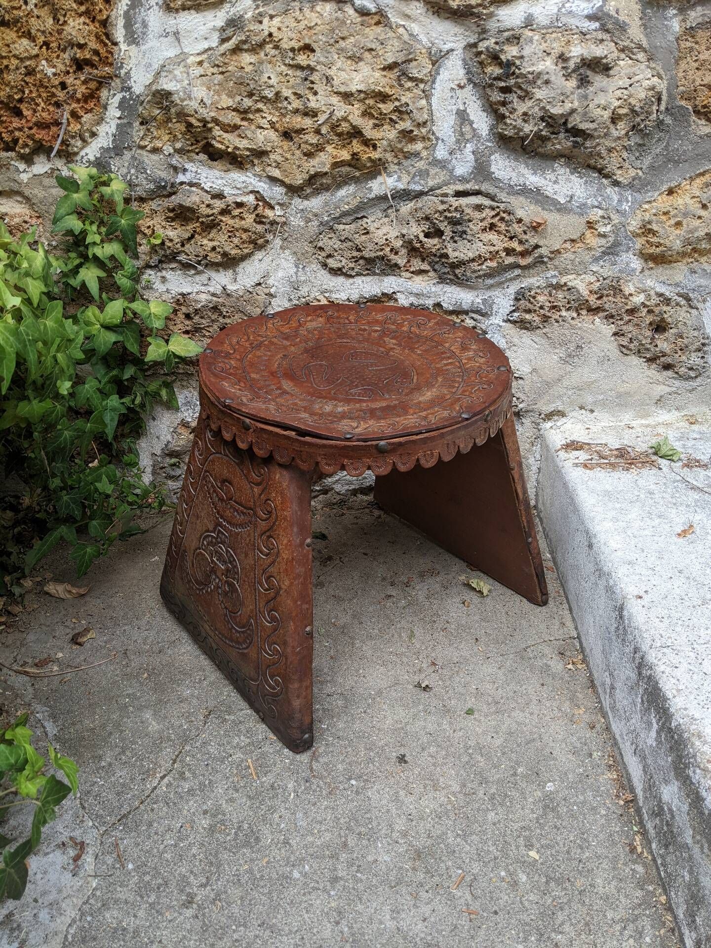Wood and leather stool, handcrafted African art.