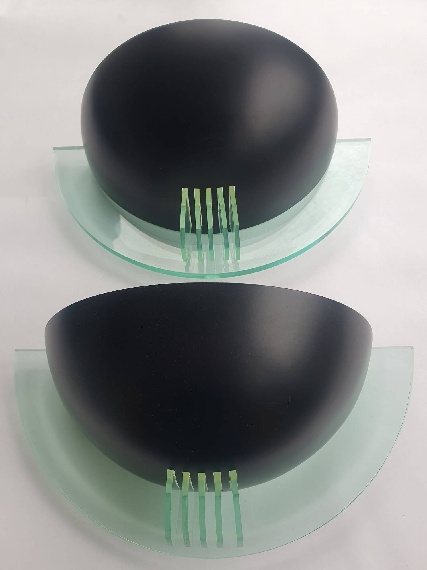 Pair of vintage black metal and plexiglass half-moon wall lights