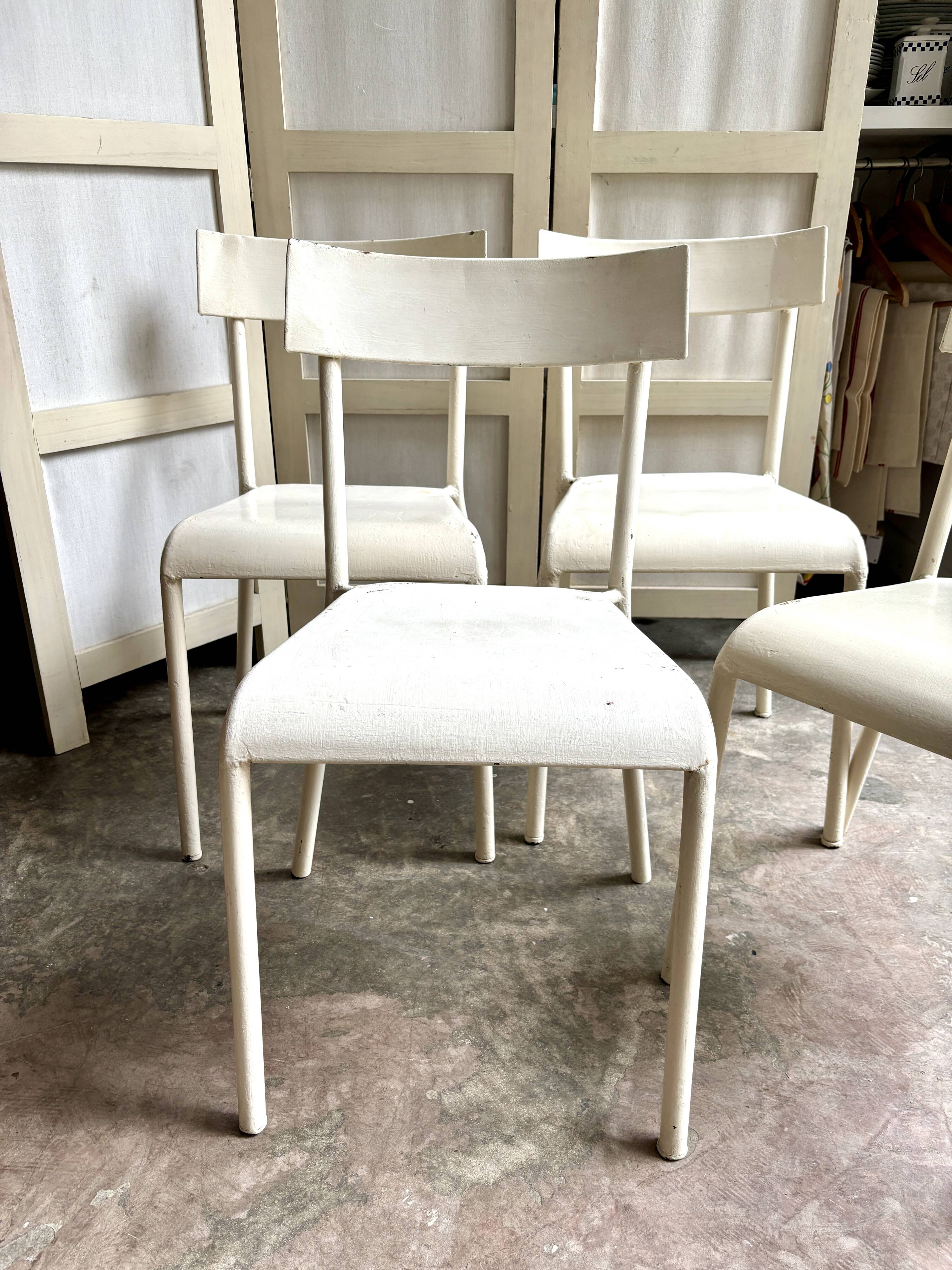 4 beige metal garden chairs