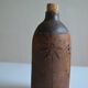 Bottle vase decorative flowers ceramic signature with fish to identify.