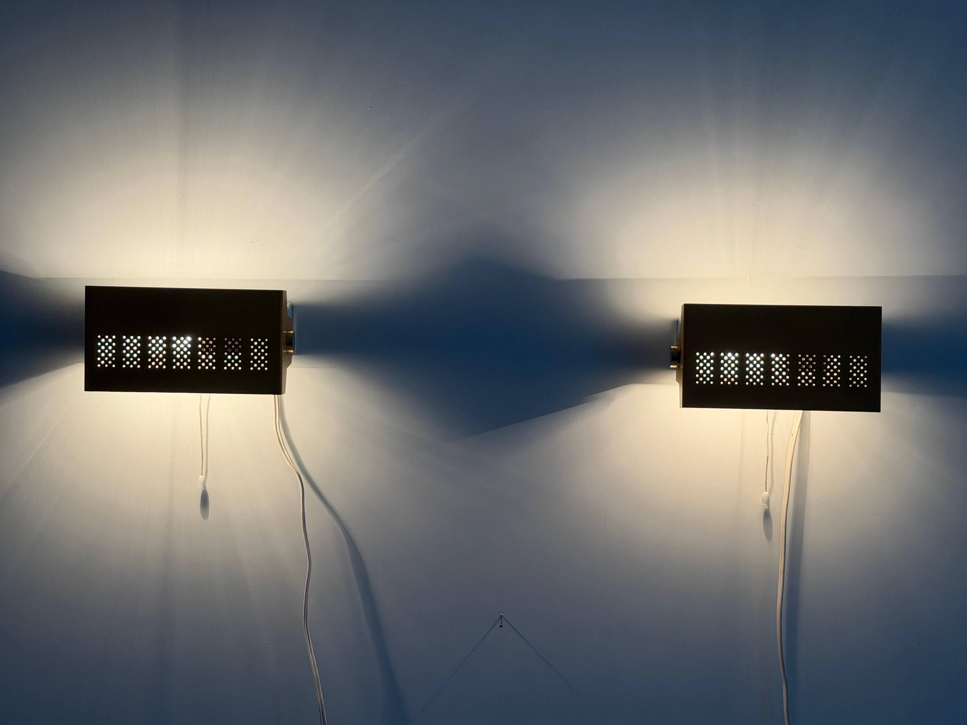 Pair of yellow metal wall lights from the mid-century by N Leuchten, 1960s, Germany.