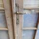 Two pairs of solid oak doors with small panes.