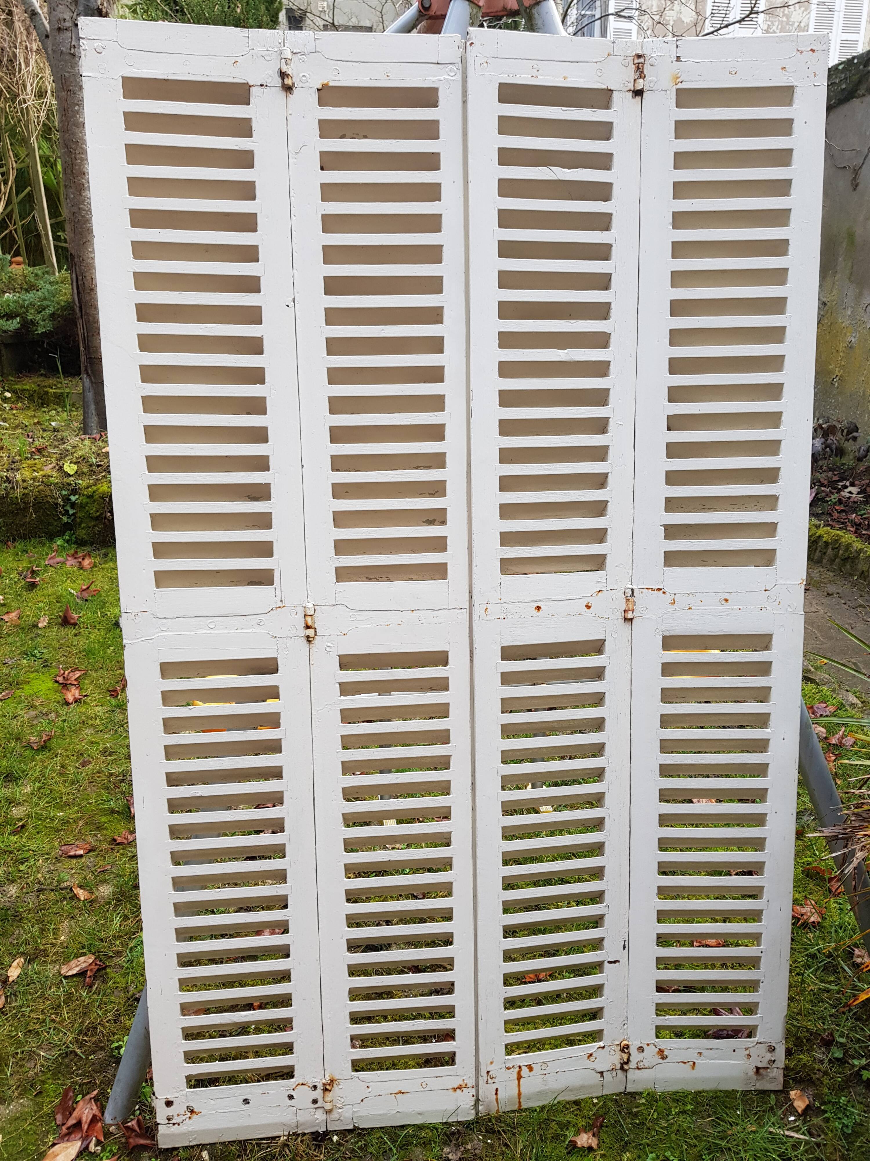 Pair of old shutters with louvers