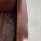 Dark cognac-coloured set of 2 sheepskin armchairs with a sleek design