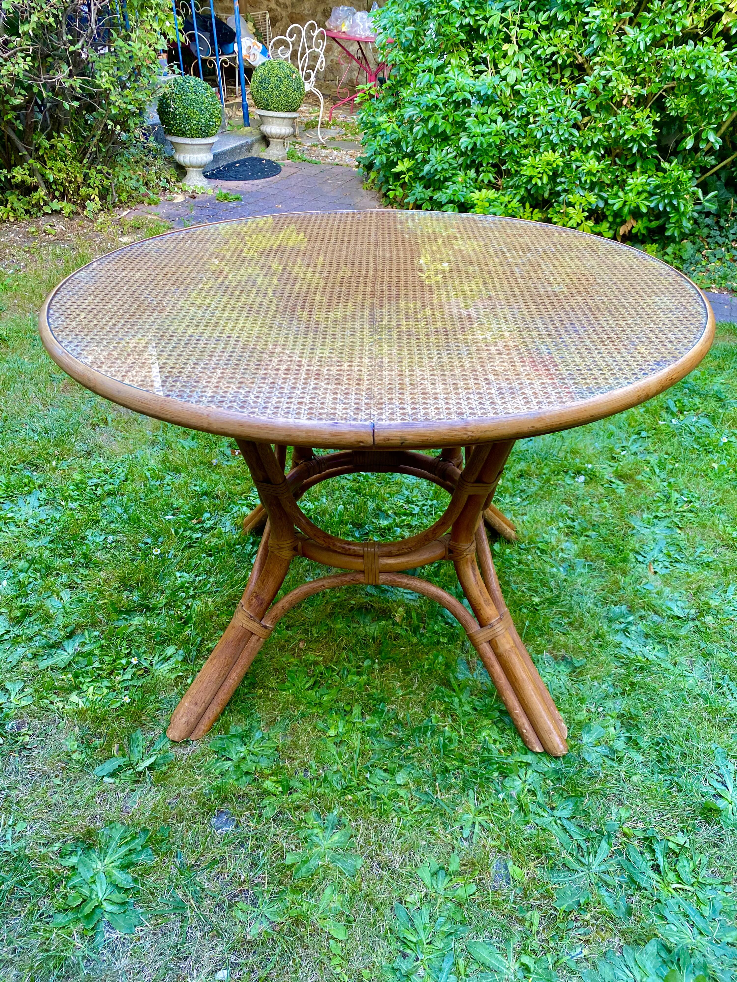 Canned rattan dining table and vintage glass