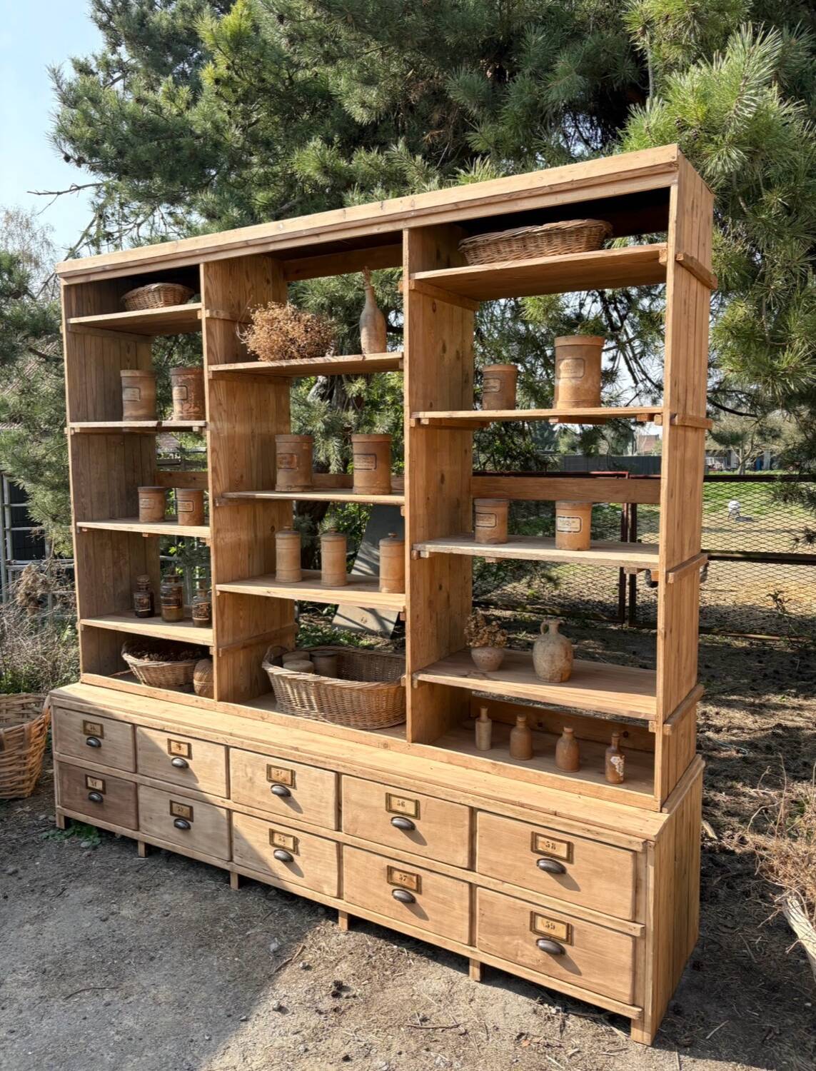 Large antique workshop furniture with drawers and shelves.