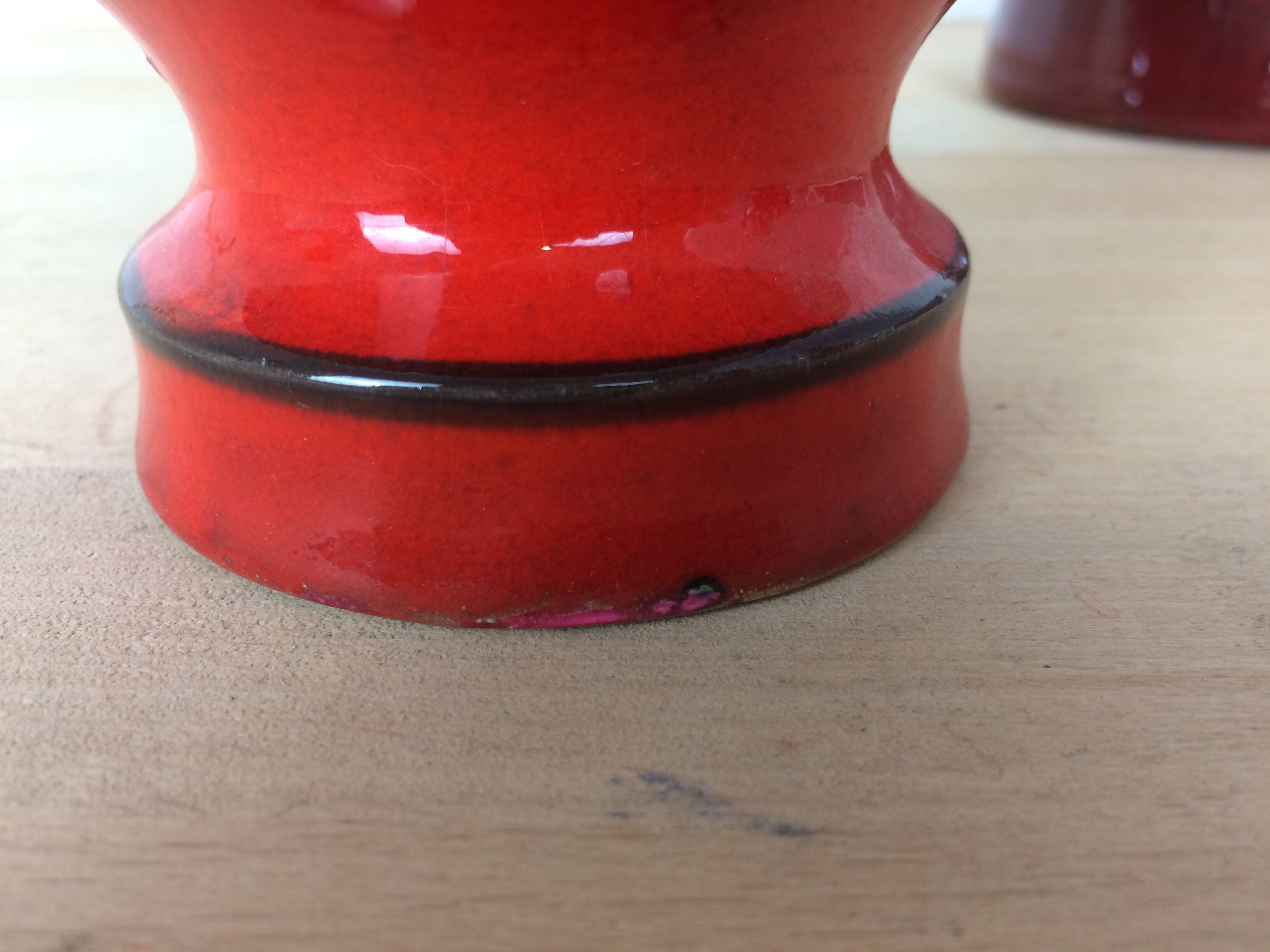 3 red ceramic vases