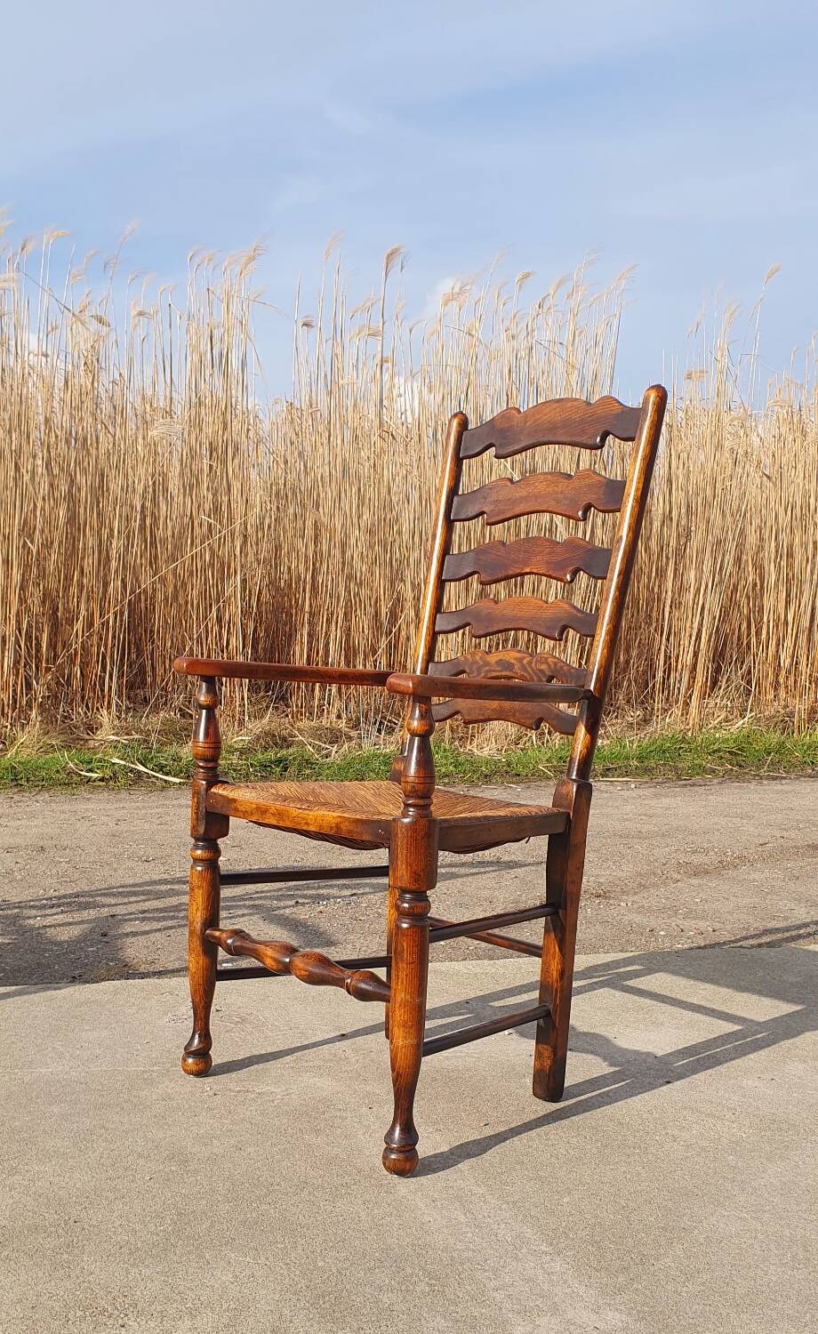 Set of 4 rustic vintage armchairs in English farmhouse style with rush seats.