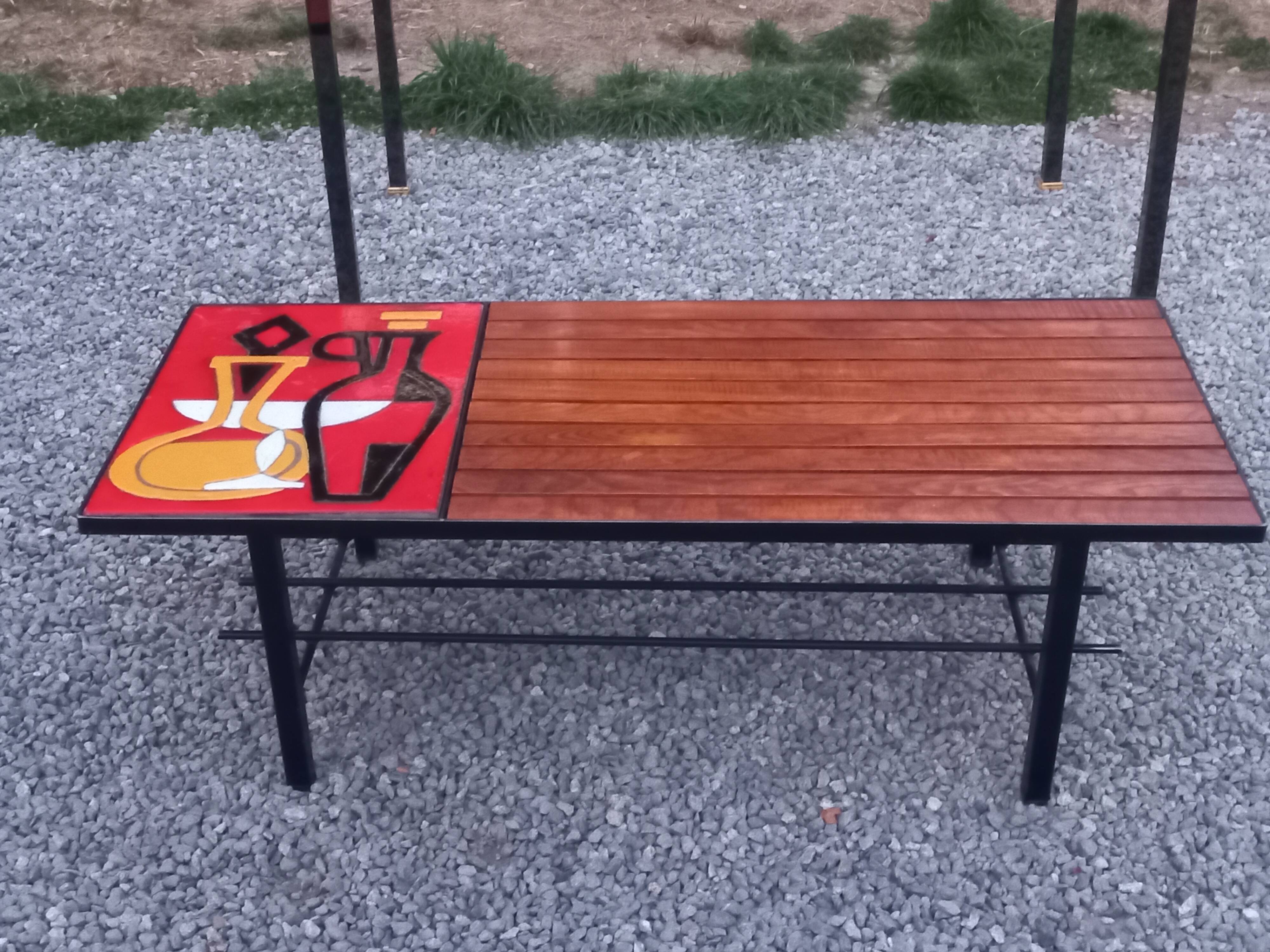 1970s design coffee table with ceramic and wood top, metal legs.