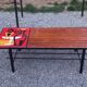 1970s design coffee table with ceramic and wood top, metal legs.