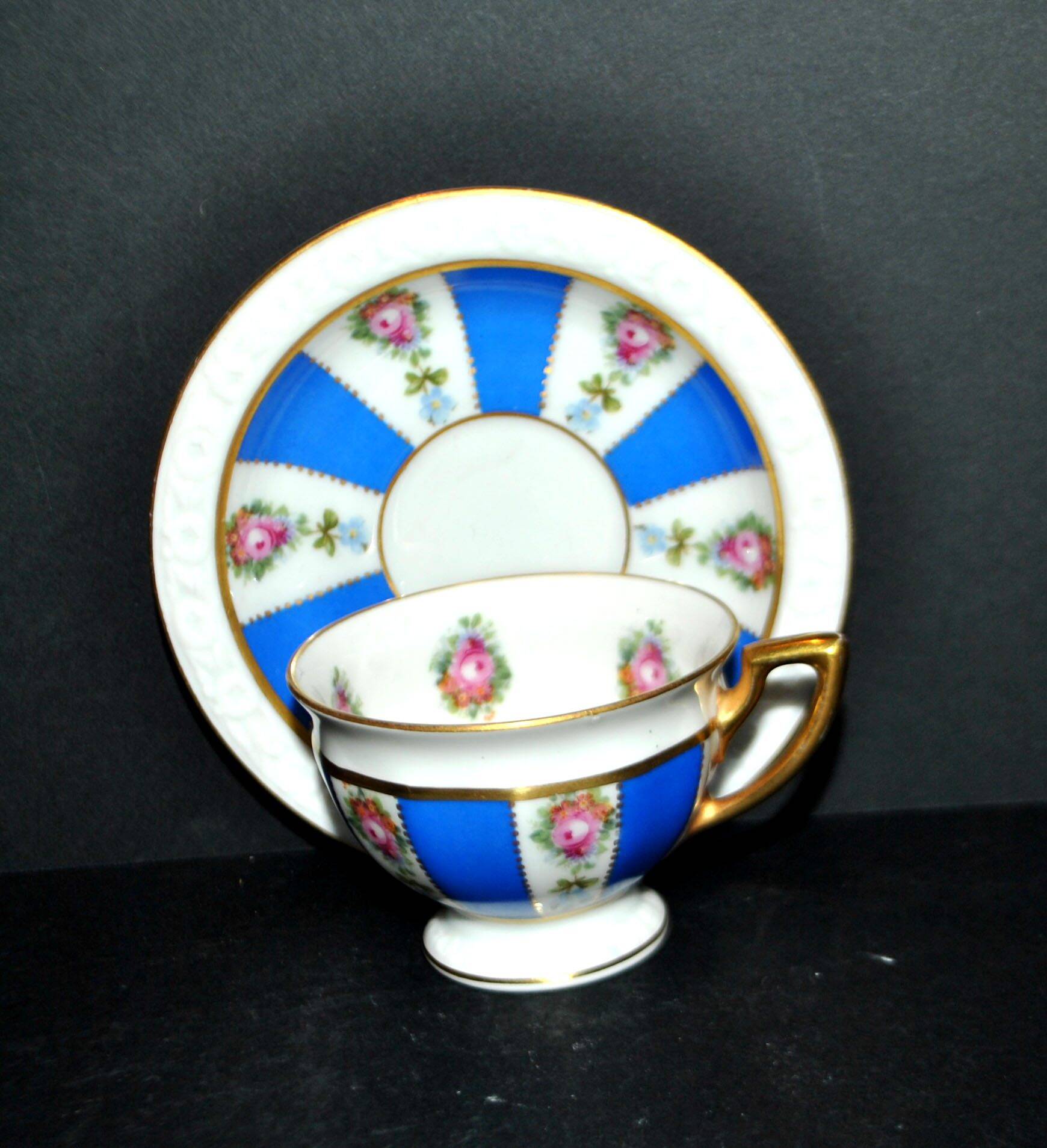 Maria collector's cup in blue and gold German porcelain.
