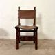 Spanish chair in leather and carved wood, 1950s/60s.