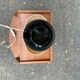 Vintage 80s table lamp with a black ceramic base and beige shade.
