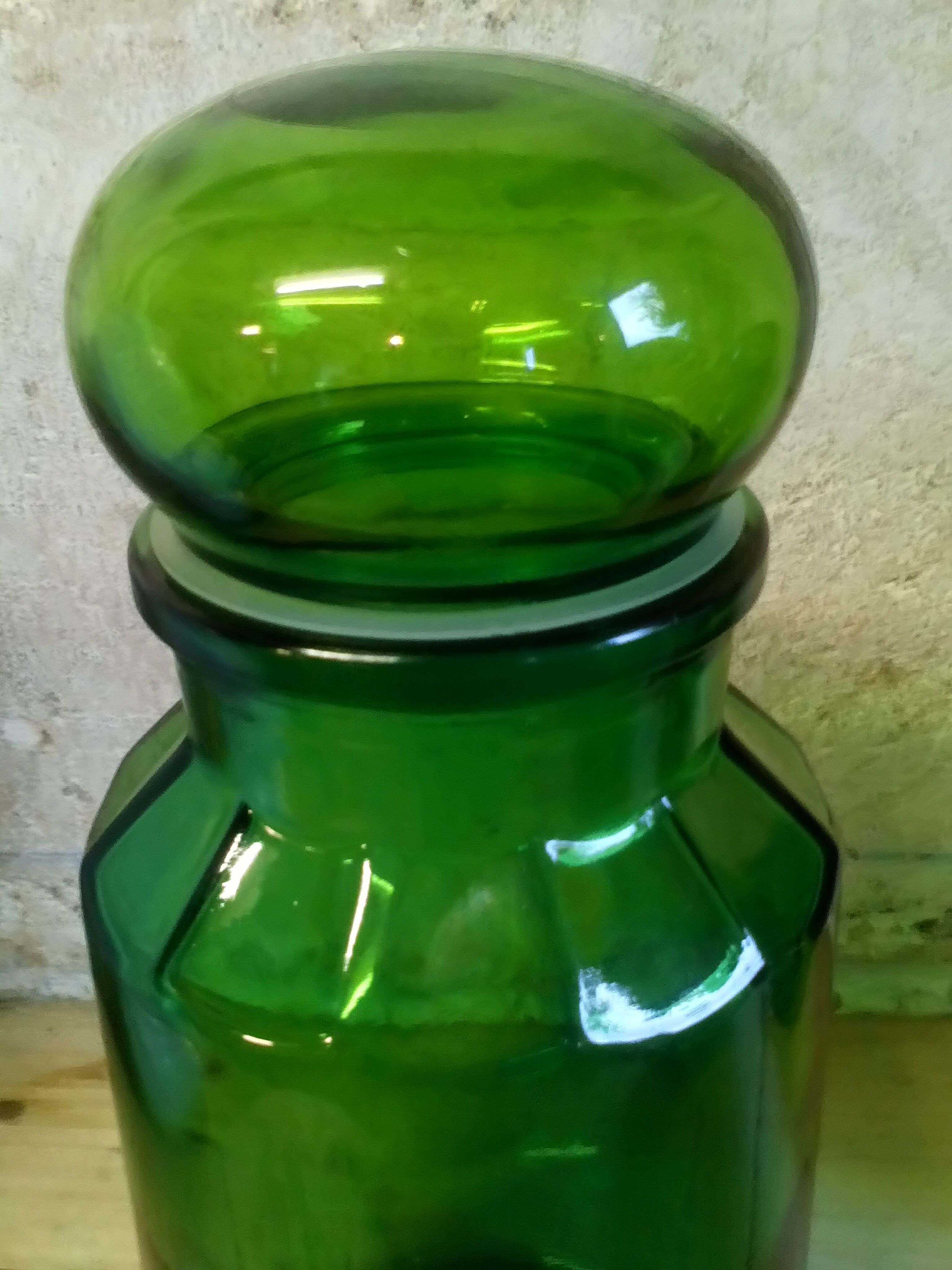 Trio of green glass apothecary bottles