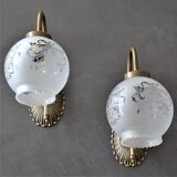 Pair of engraved glass wall lamps, brass support