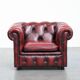 Red English cowhide Chesterfield armchair finished with decorative nails