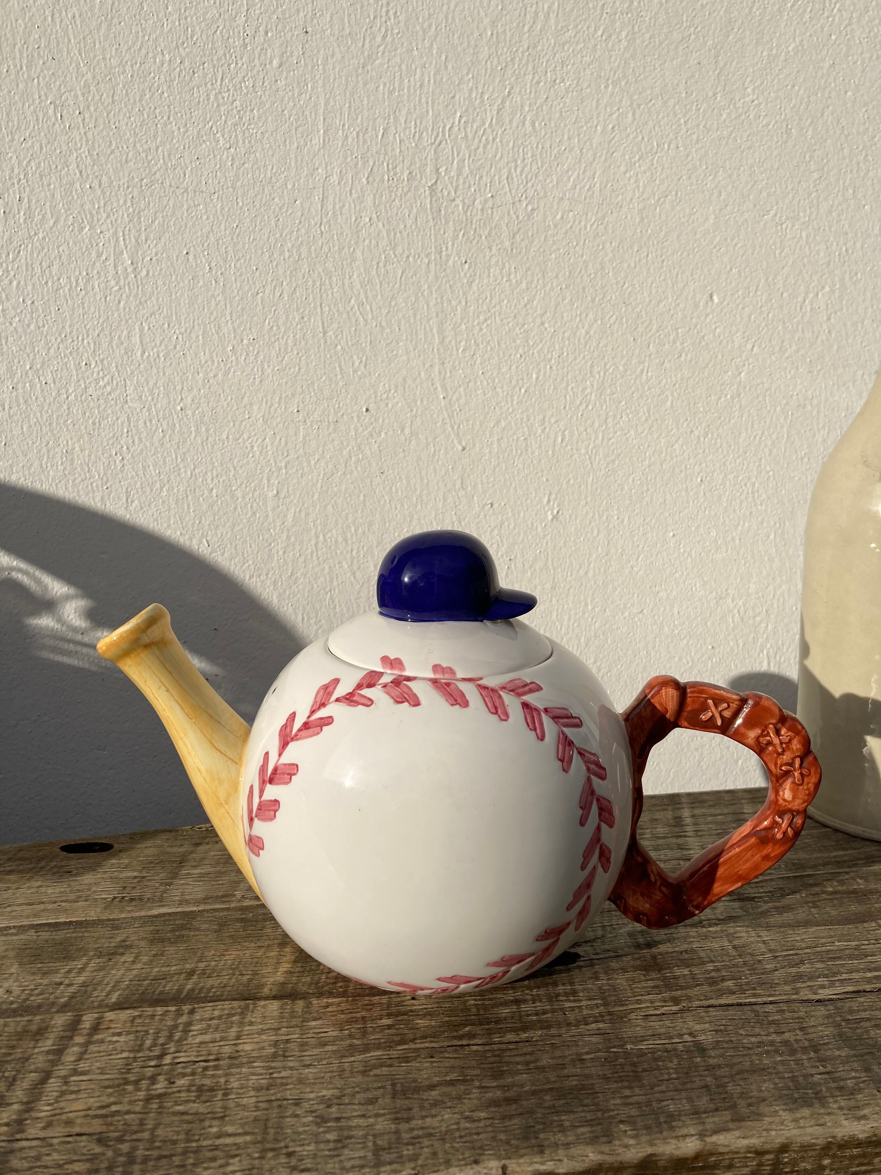 Teapot in white ceramic baseball
