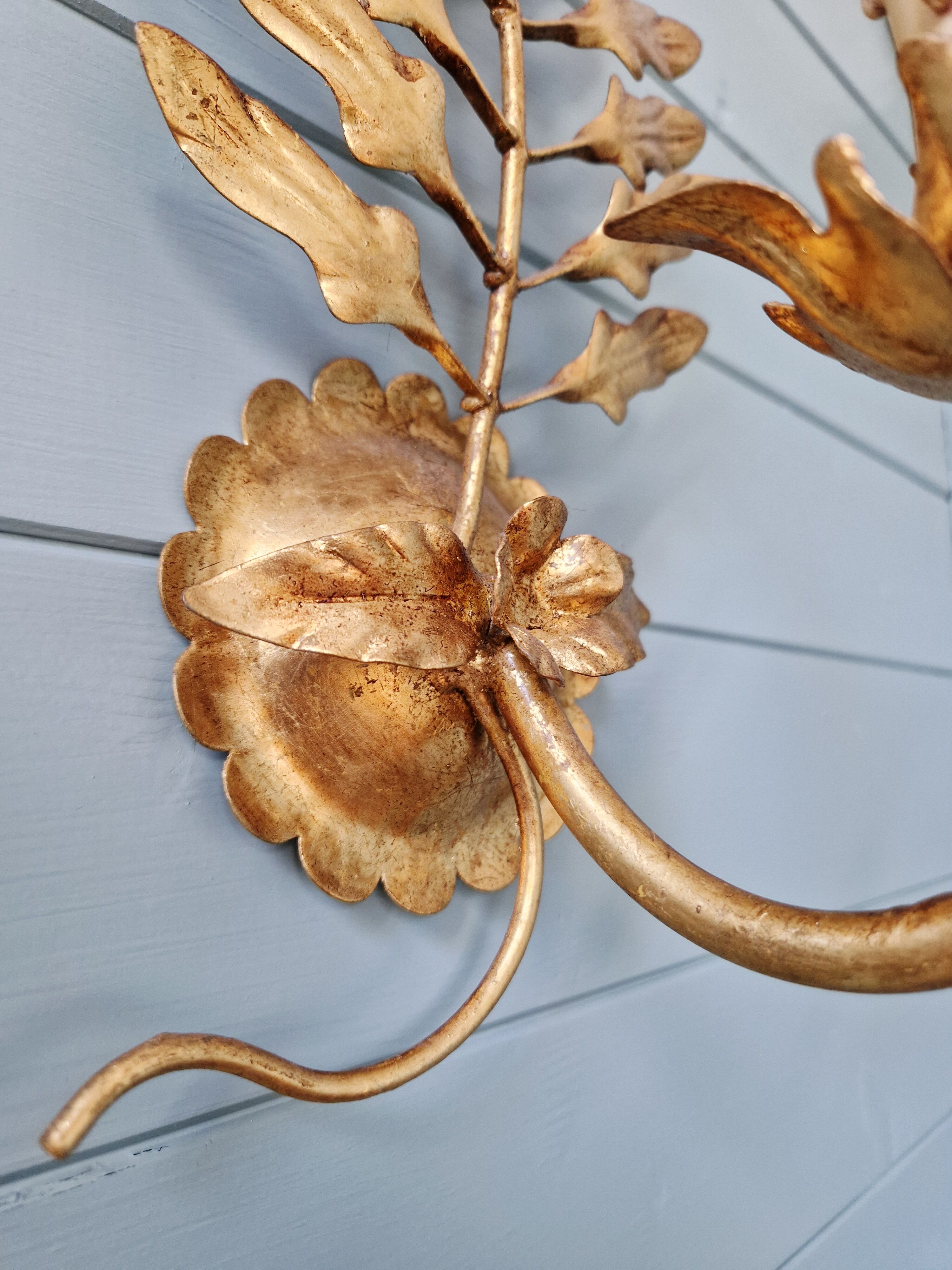 Pair of gold metal wall sconces in Hollywood Regency style, 1970s.