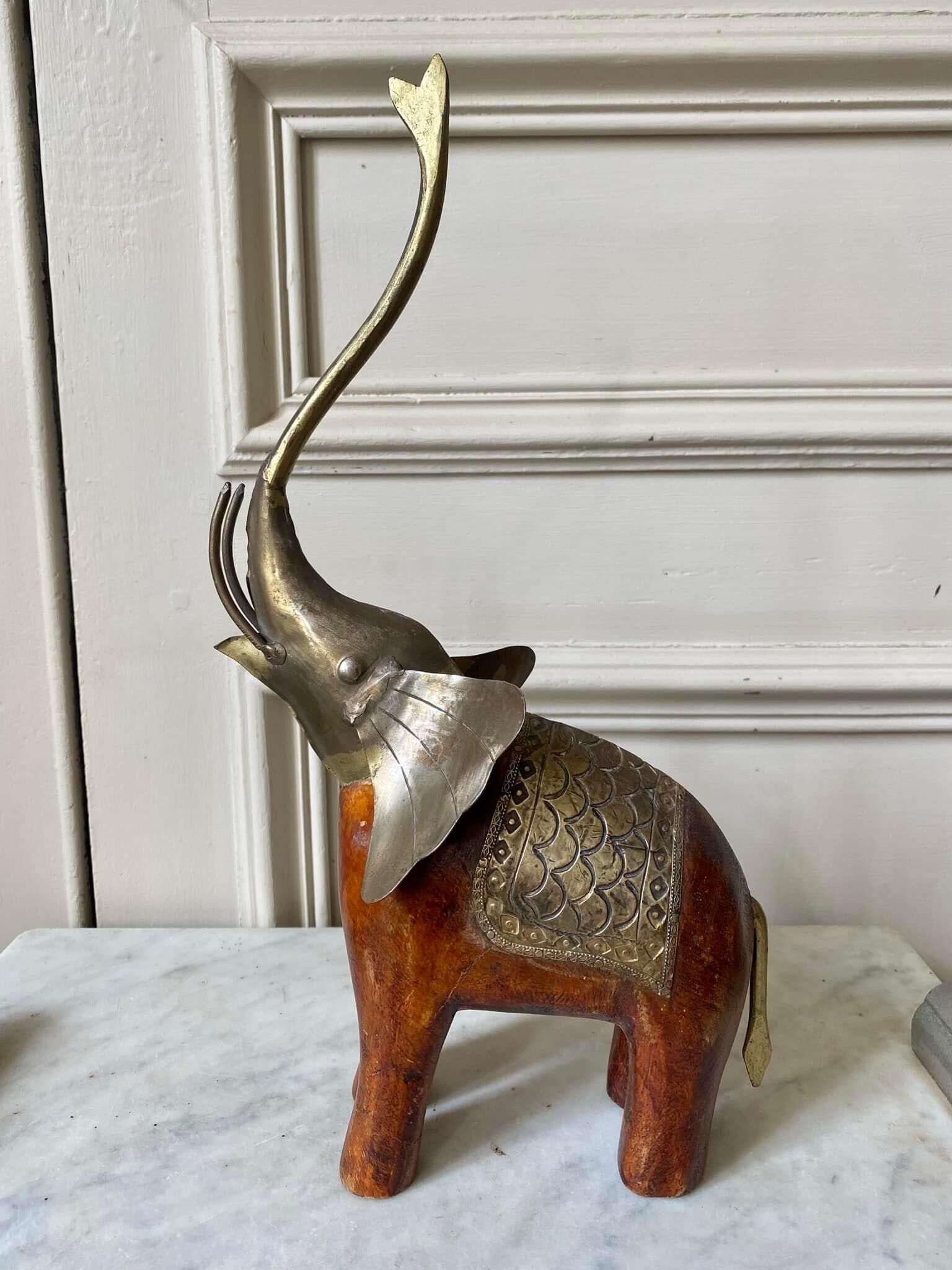 Wooden elephant and brass