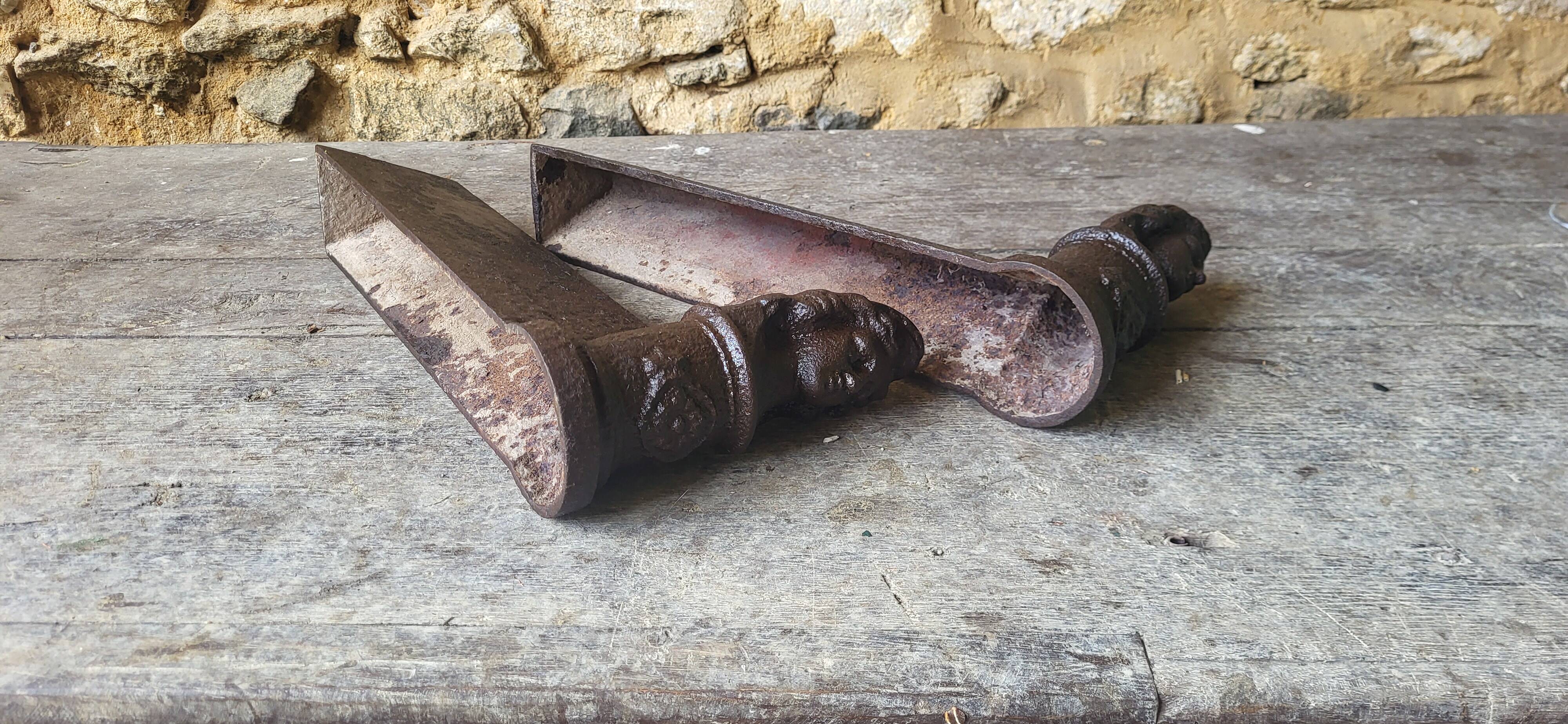 Pair of cast iron andirons from the 19th century