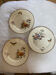 Lot de 3 assiettes plates en terre de fer polychrome E. Bourgeois