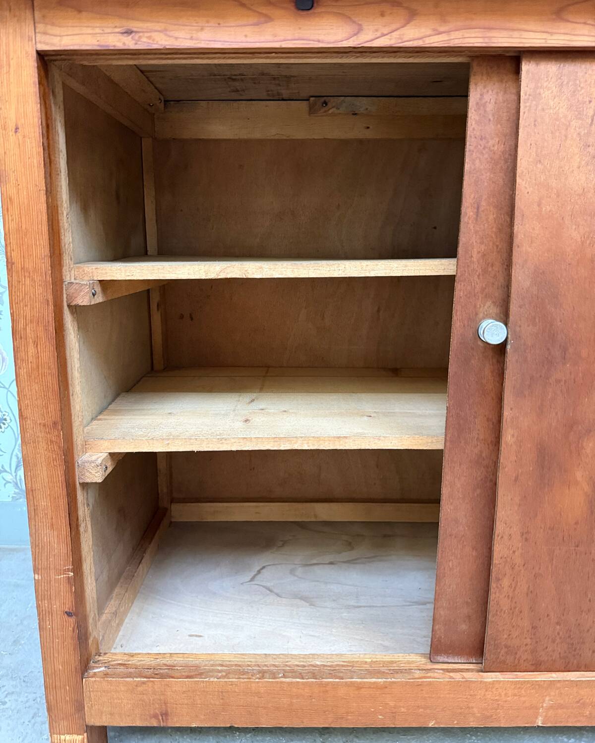 Vintage sideboard with sliding doors