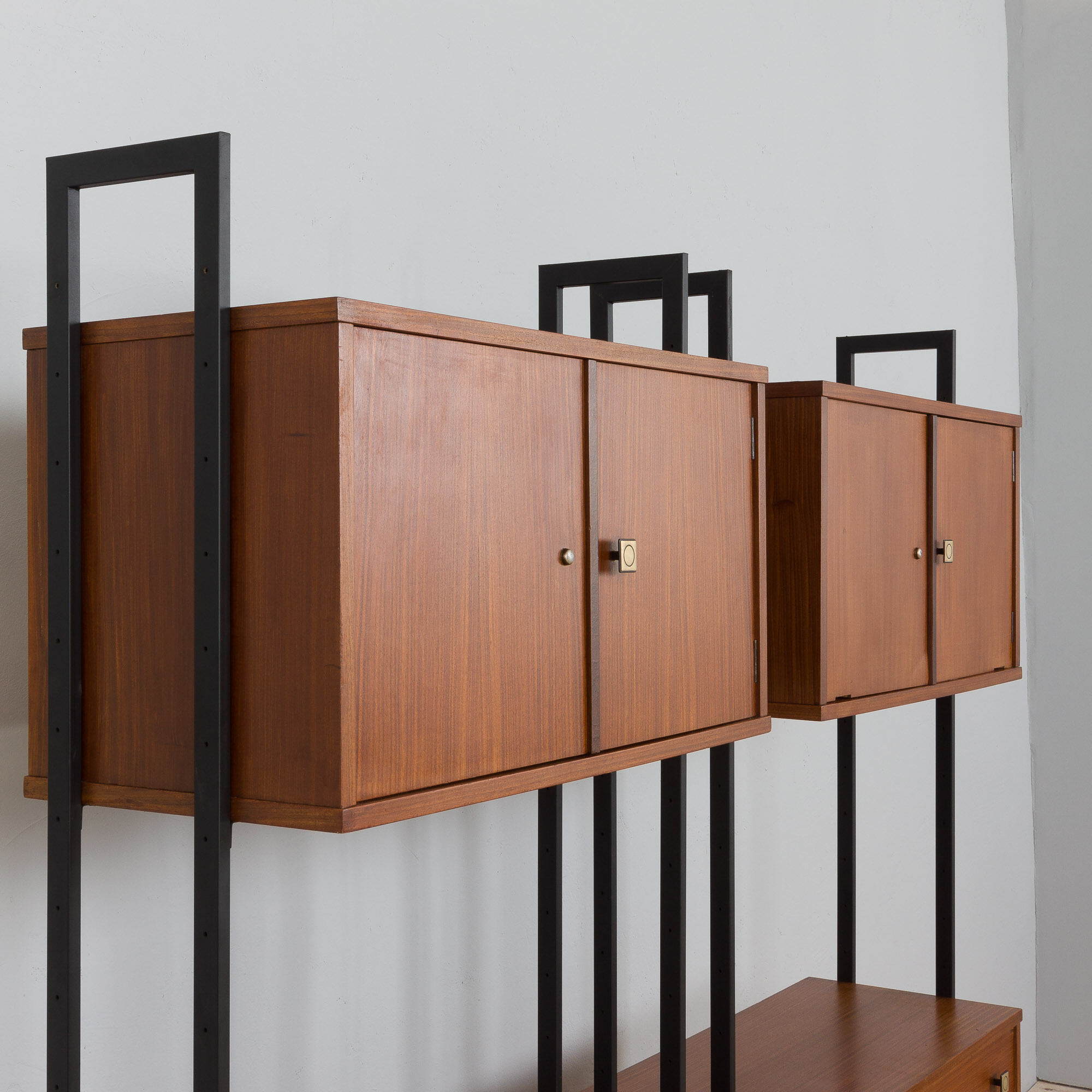 Pair of Italian mid century freestanding wall units in teak with brass handles.