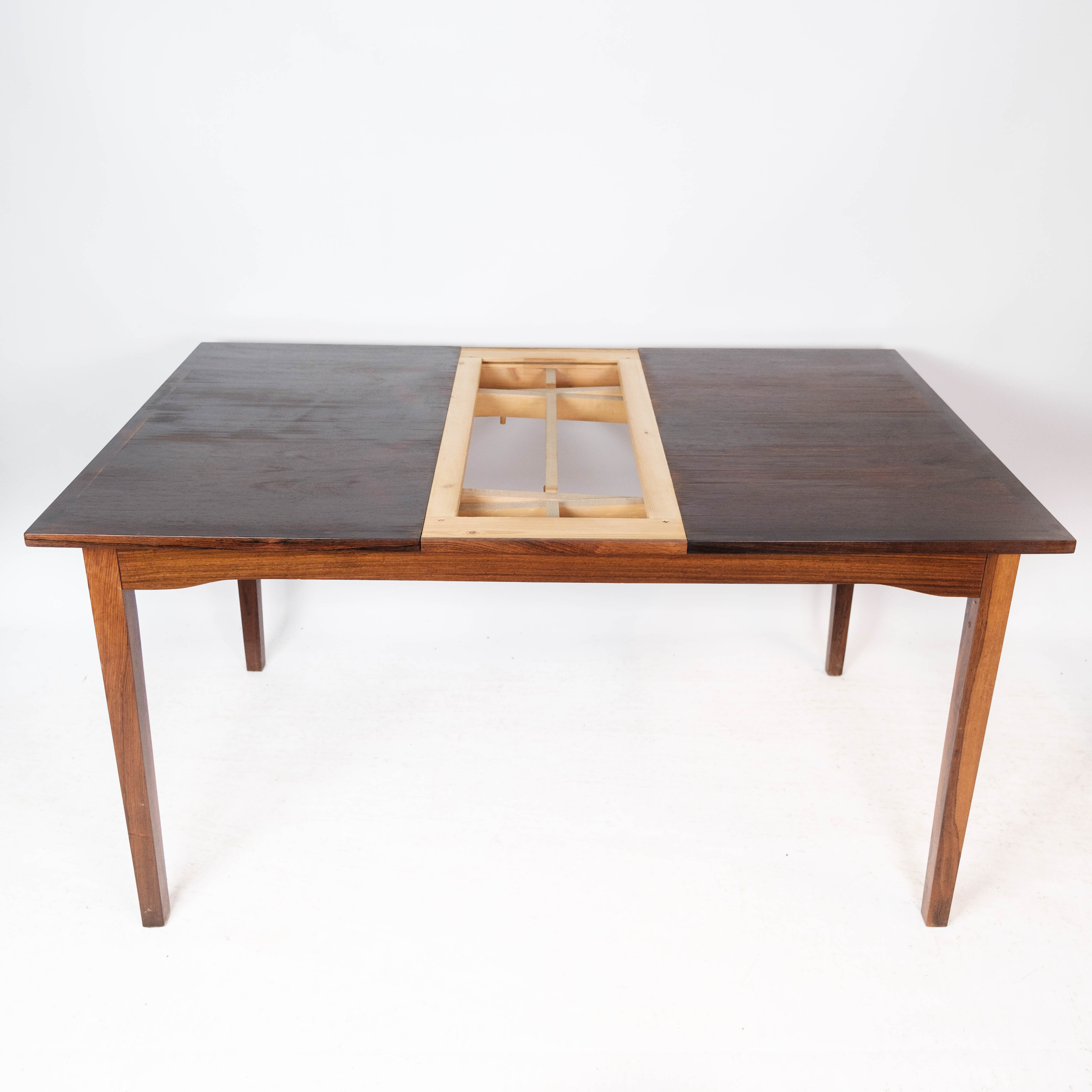 Dining table in rosewood with extension, of Danish design by Ellegaards Furniture, 1960s