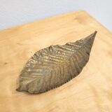 Bronze leaf-shaped pocket emptier