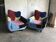 Set of 2 multicoloured Mid-Century armchairs in fabric, with black painted legs.
