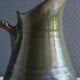 Vintage ceramic pitcher vase in glazed green and blue.