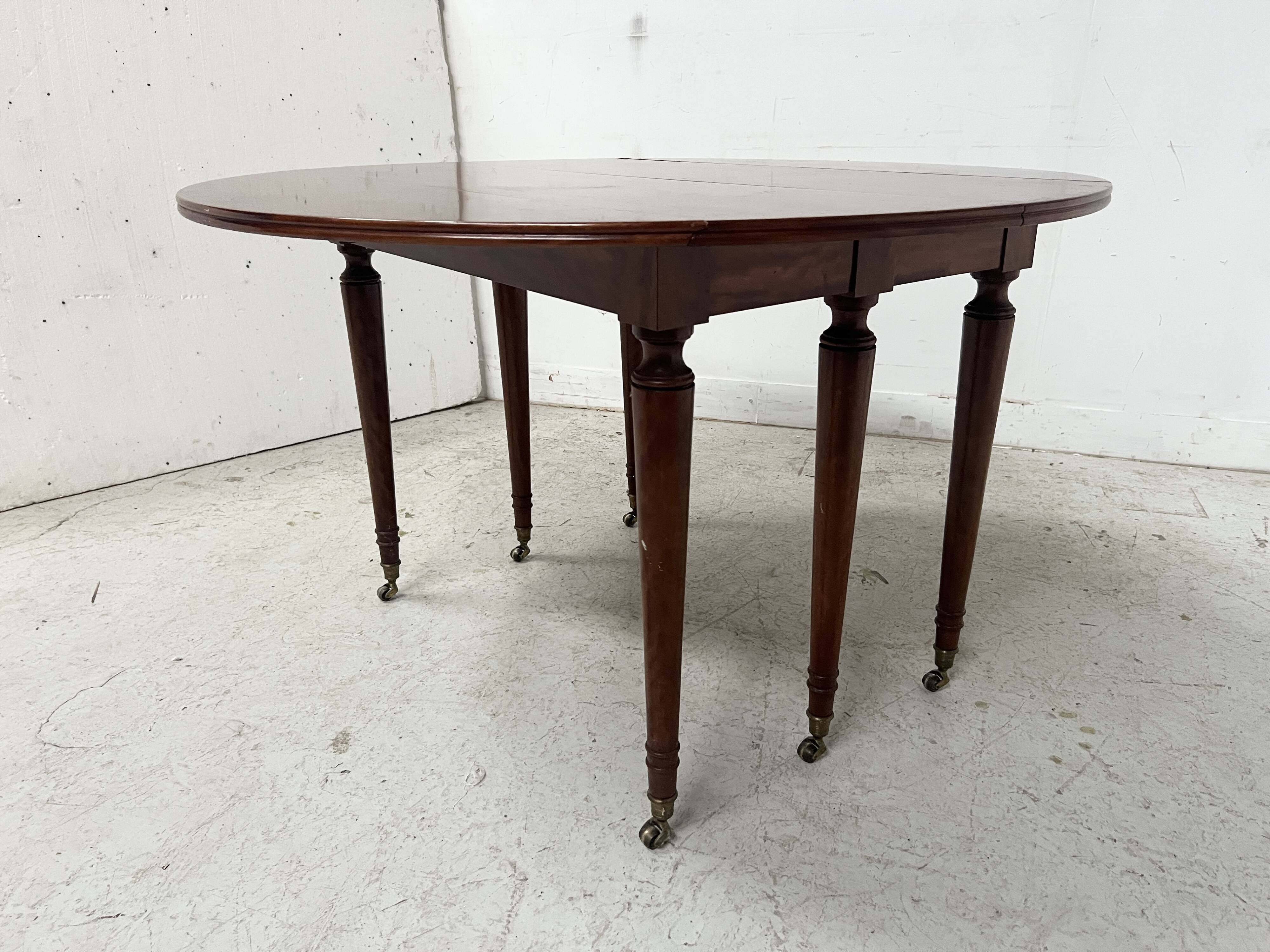 A six-foot Louis XVI style mahogany table from the 19th century.