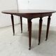 A six-foot Louis XVI style mahogany table from the 19th century.