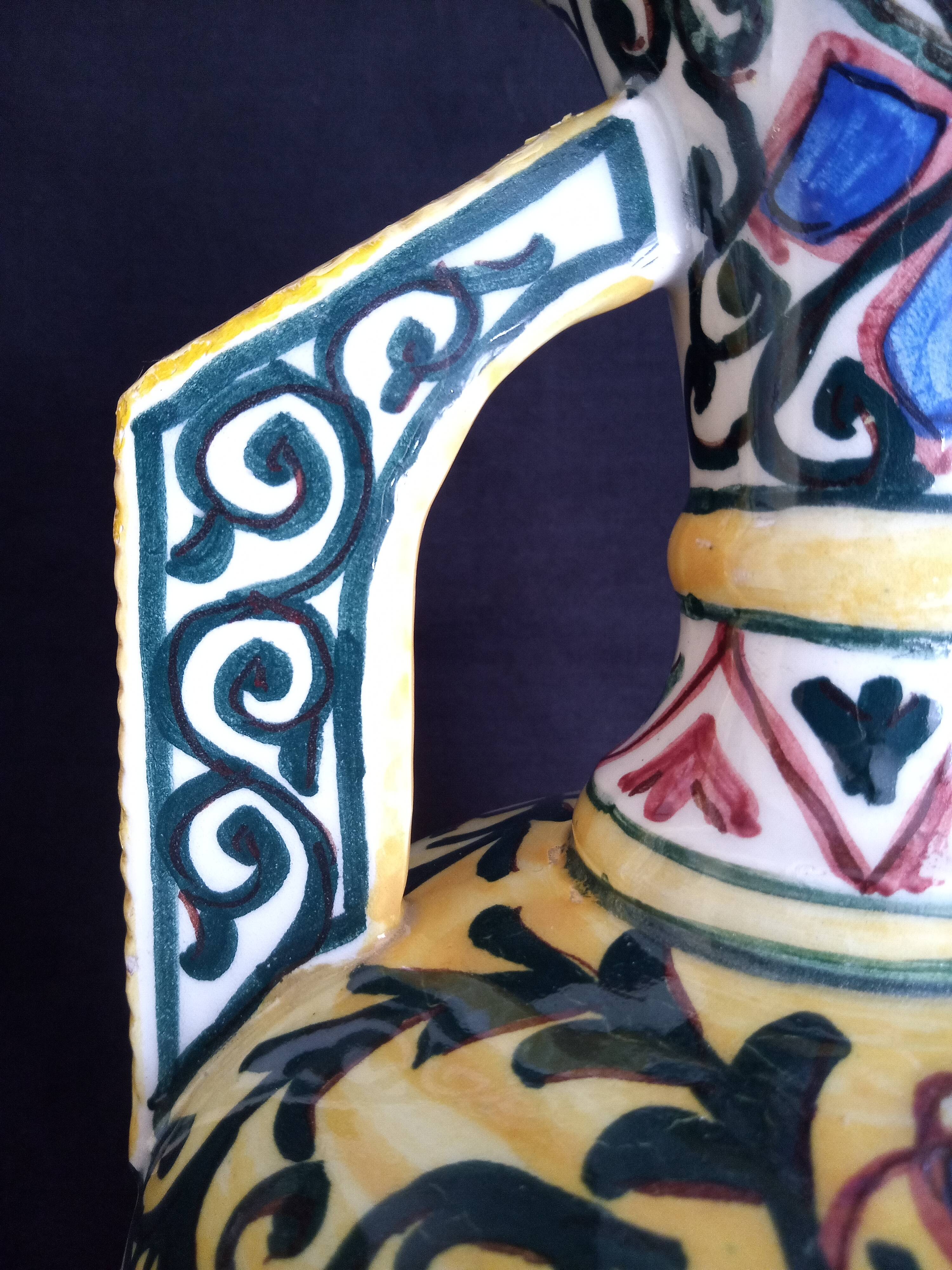 Art Deco ceramic vase with brightly colored abstract patterns