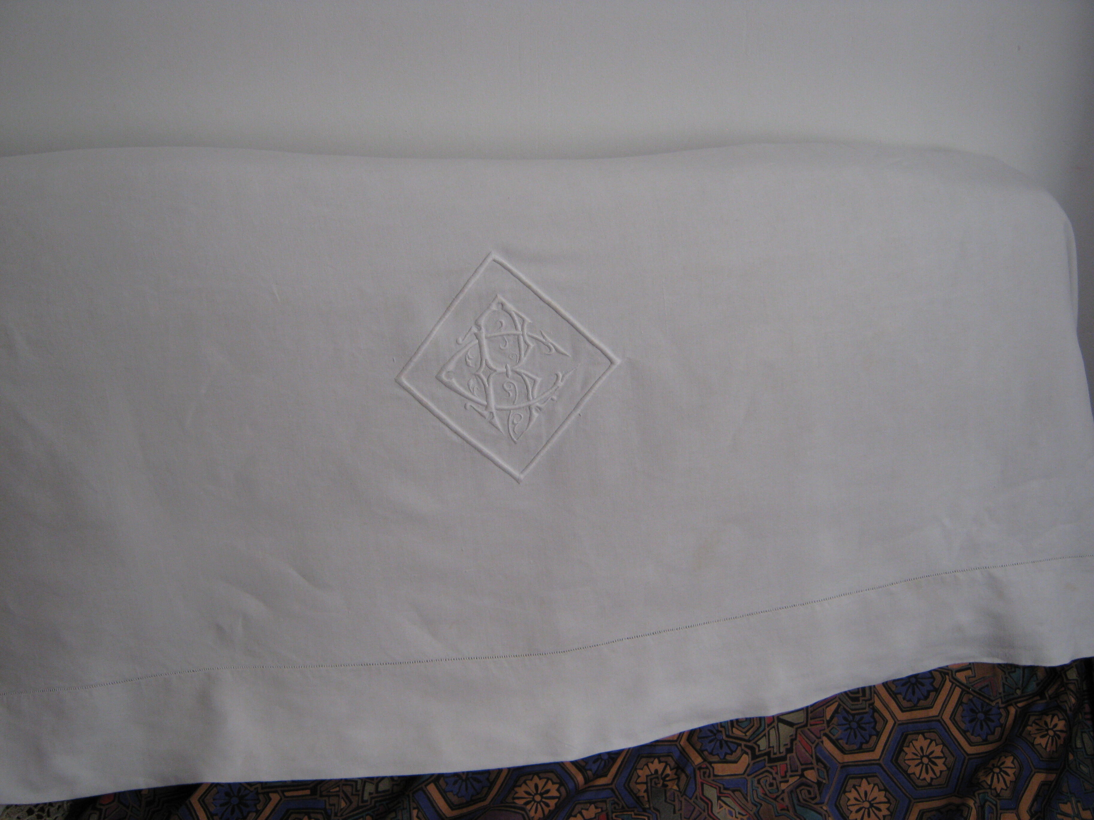 Old sheet in monogram white thread