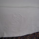 Old sheet in monogram white thread