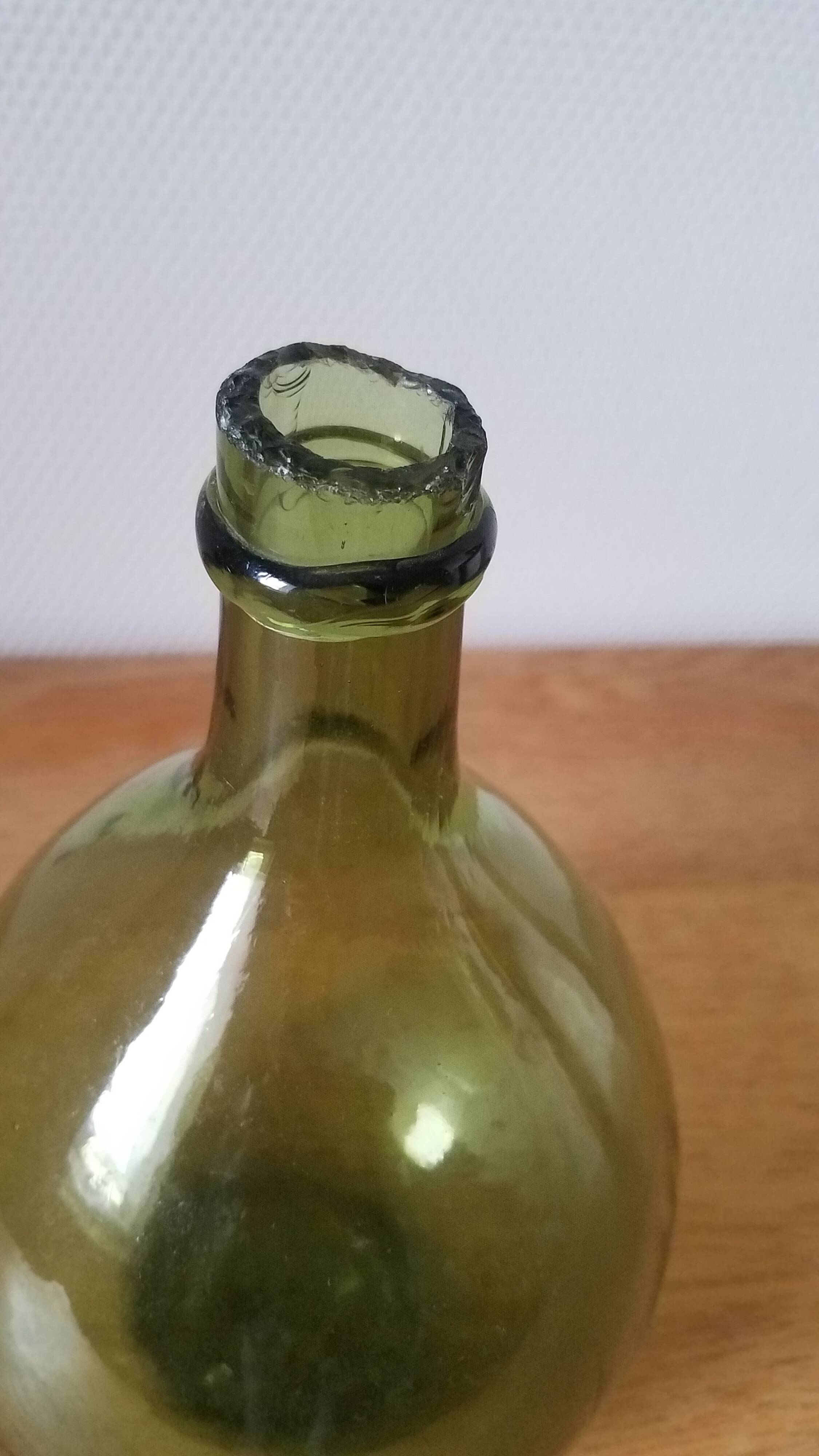 Vintage green demijohn