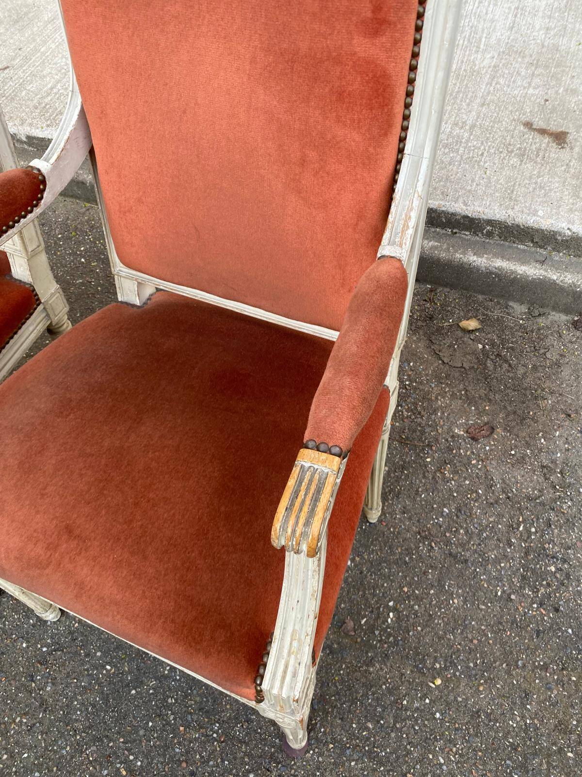 2 Louis XVI armchairs in solid wood and orange velvet.