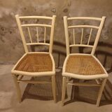 2 white wooden chairs