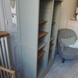 Vintage furniture transformed into a bookcase, verdigris patinated sideboard.
