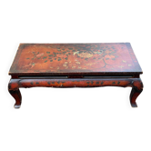 Asian coffee table with flower patterns.