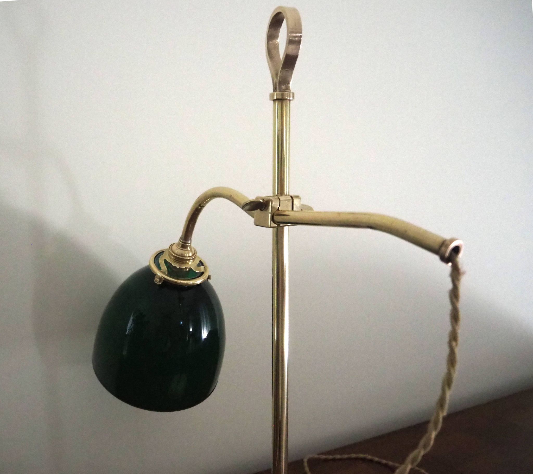 Desk lamp in brass with a swan neck and green opaline glass.