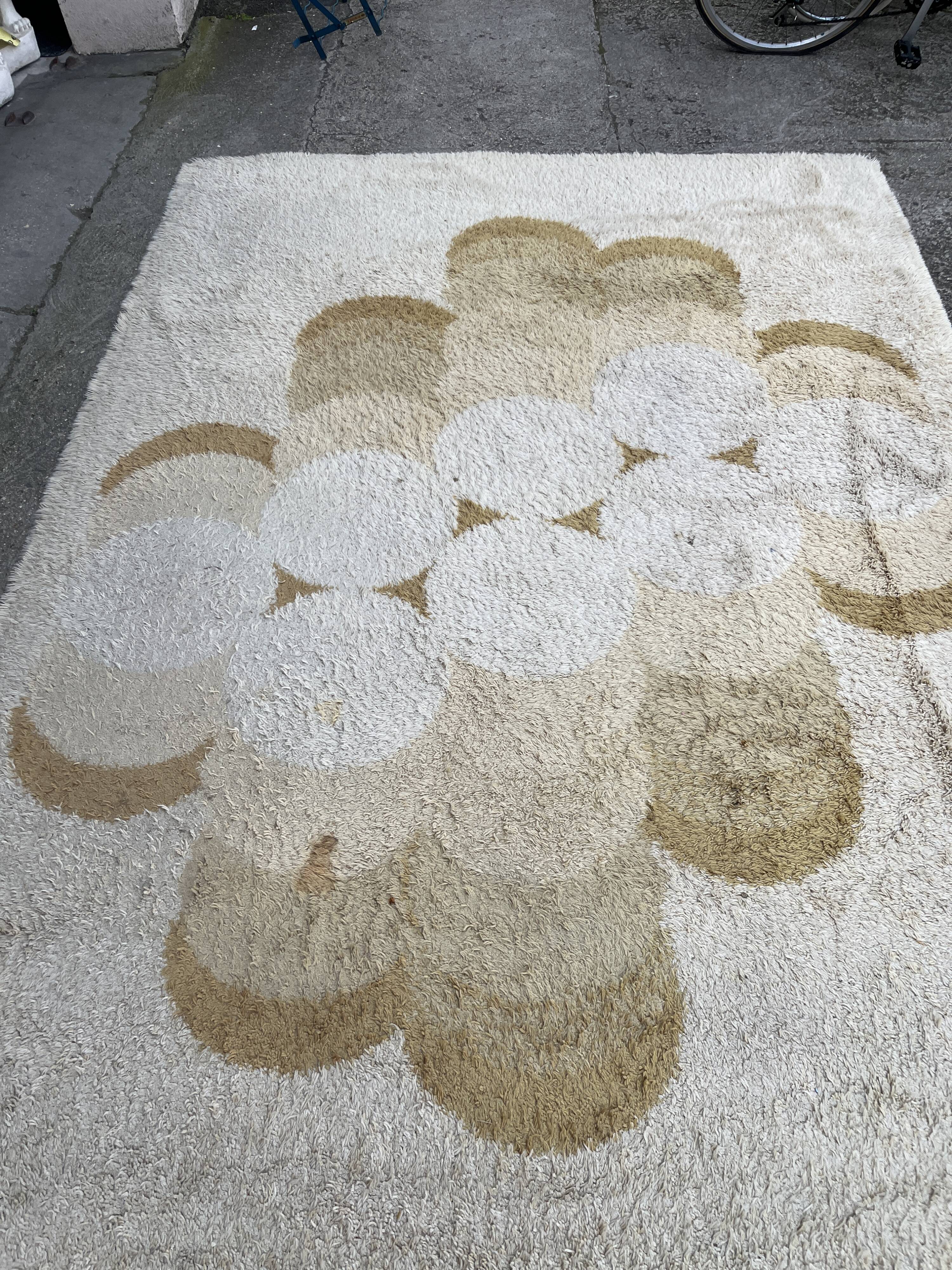 Large rug with floral decoration.