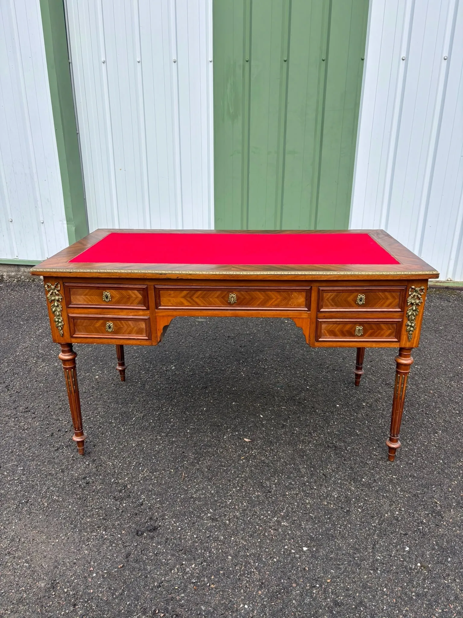 Elegant flat desk in Louis XVI style made of marquetry wood.
