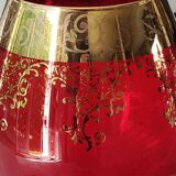 Vase in the shape of a footed cup, in bohemian crystal. ruby color. scroll & floral design with 24 c gold highlights