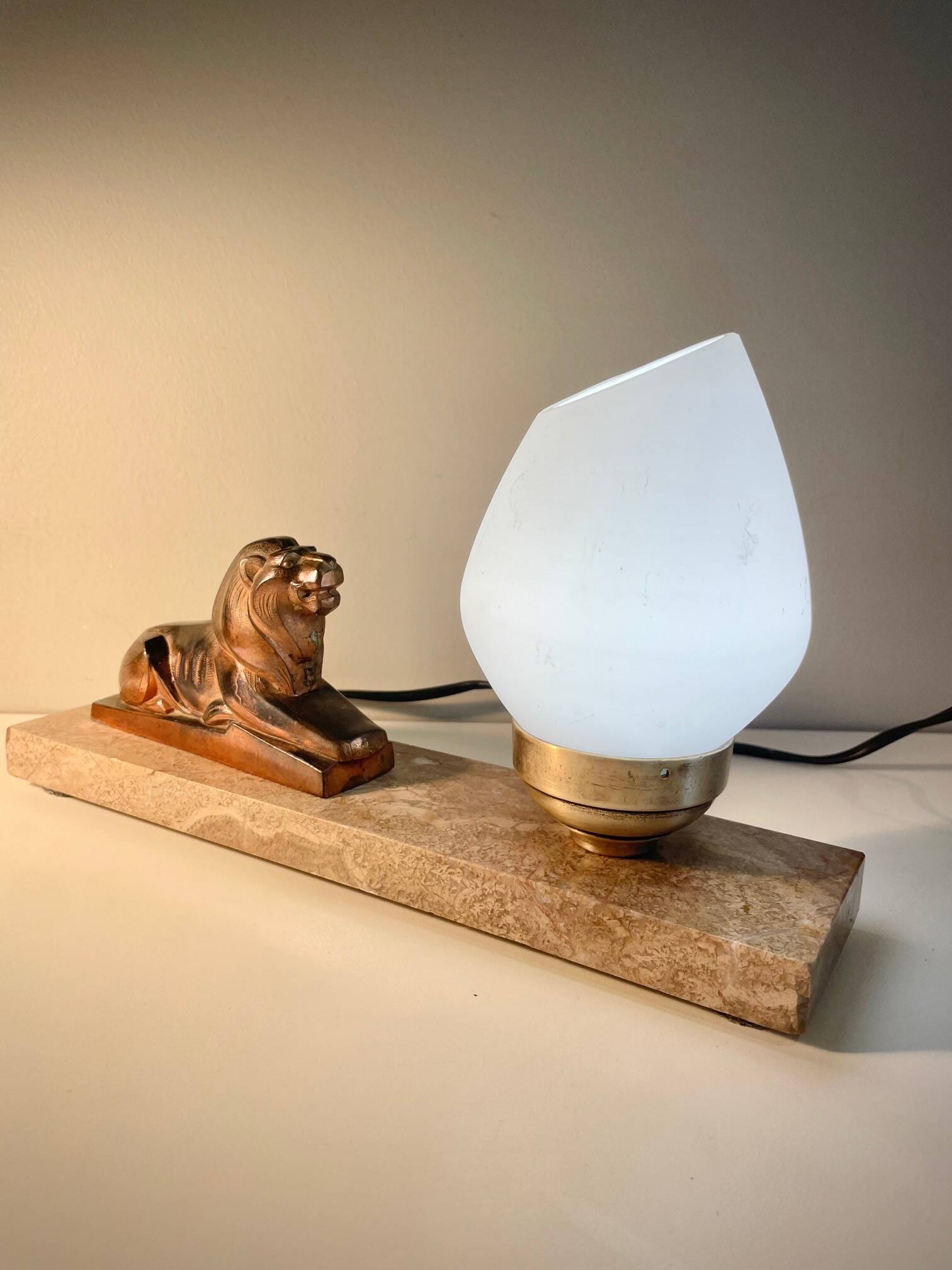 Art Deco lamp with marble, opaline globe & lion sculpture in spelter