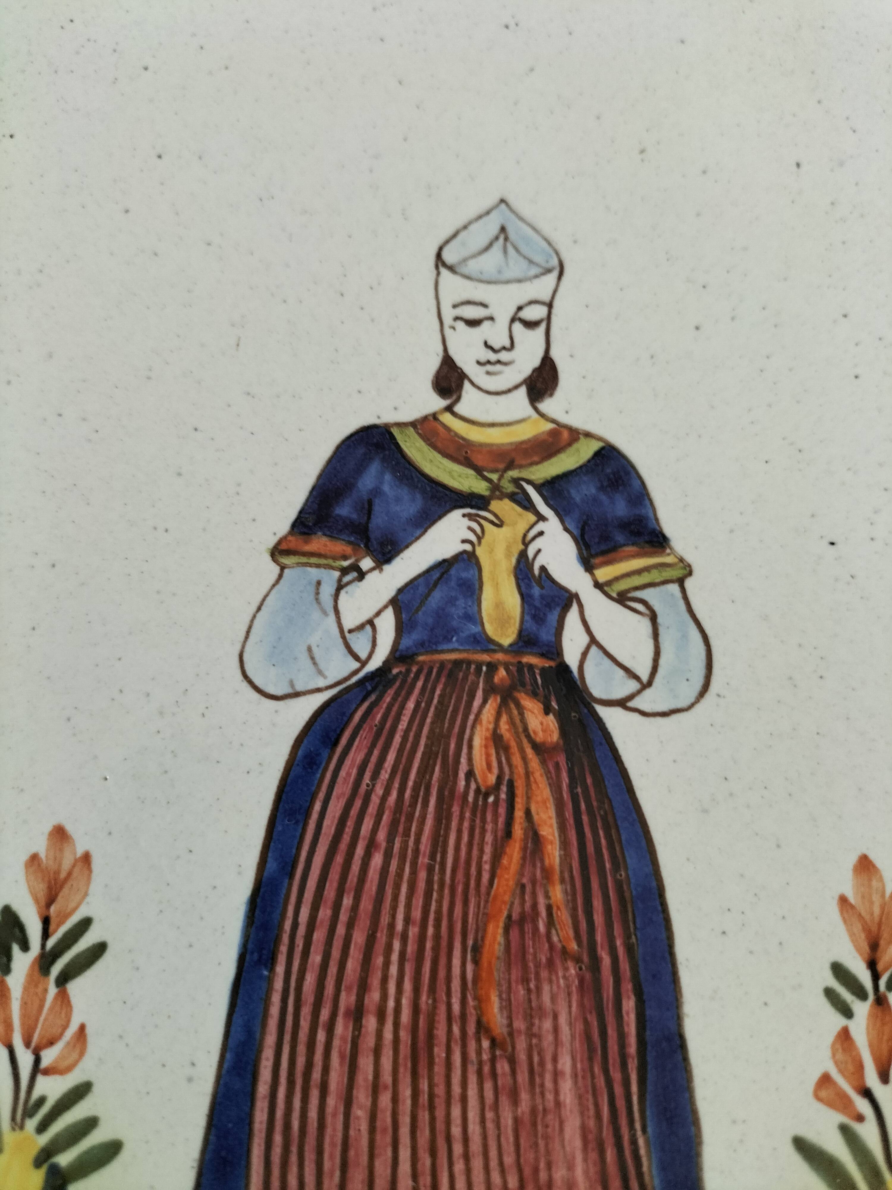 Hand-painted Breton plate, decorated with a woman knitting, 1950s