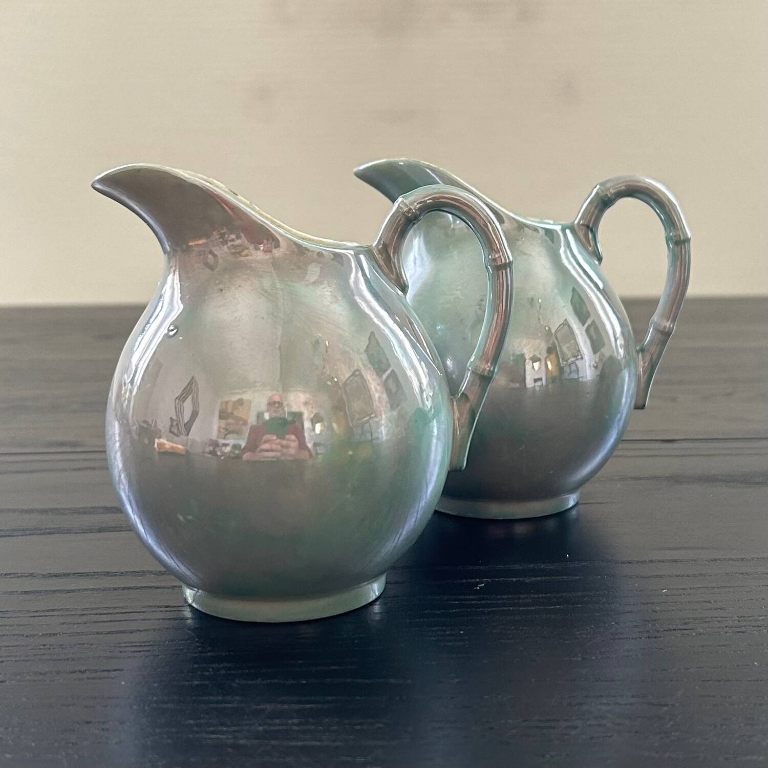 Pair of iridescent blue pitchers